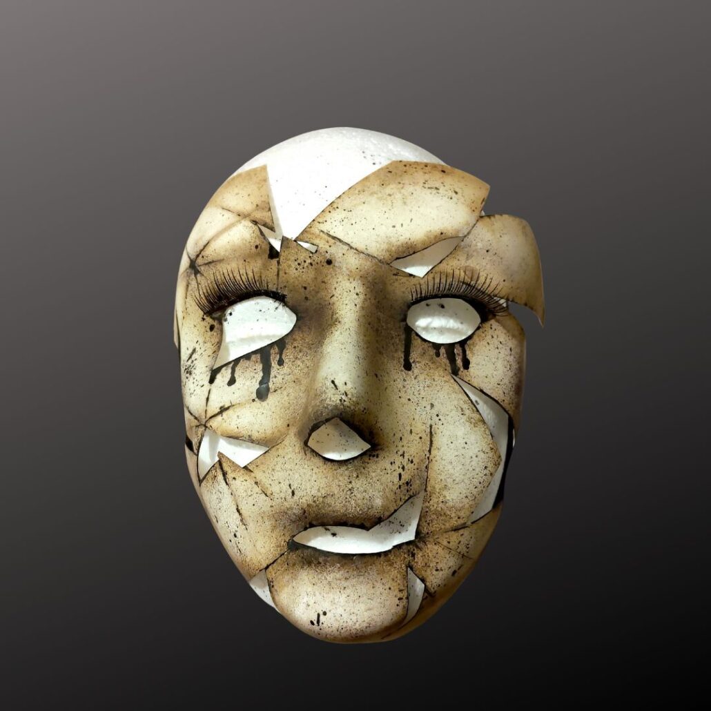 Zwarte tranen en barstlijnen aangebracht met penseel voor enge pop schmink