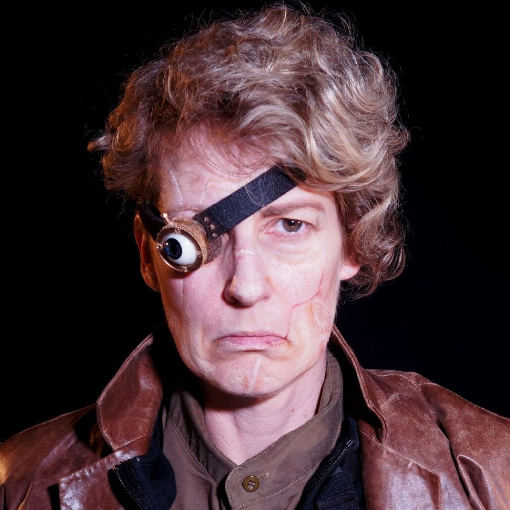 Volledige Mad-Eye Moody Halloween schmink met kunstoog, realistische grime, verkrijgbaar bij SchminkenGrime.nl