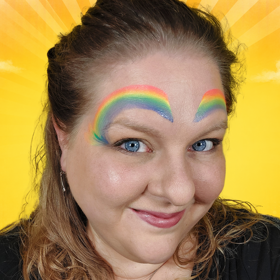 DFX splitcake Neon Nights boogjes geschminkt van voorhoofd naar ooghoeken met regenboog verloop, verkrijgbaar bij SchminkenGrime.nl