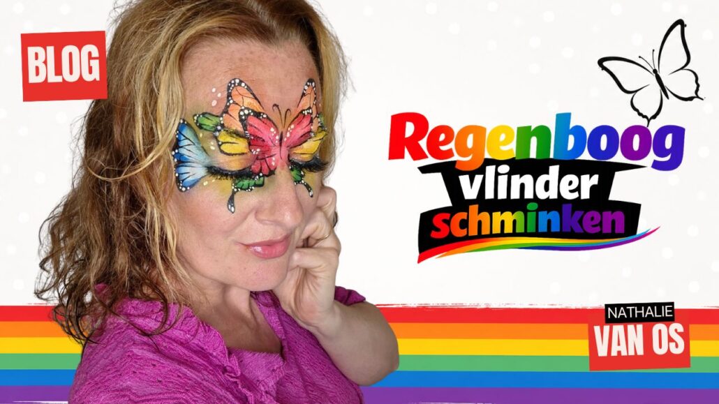 Vrolijke regenboog vlinder als oogmasker geschminkt rond beide ogen en op het voorhoofd, met blauwe, groene, oranje, gele en rode vleugels, zwart lijnwerk en witte stippen, verkrijgbaar bij SchminkenGrime.nl.