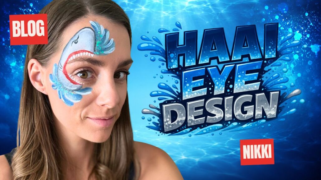 Geschminkt haai eye design rond het oog met grijze haaienkop, rode bek, witte tanden en blauwe waterspatten met glitter, verkrijgbaar bij SchminkenGrime.nl